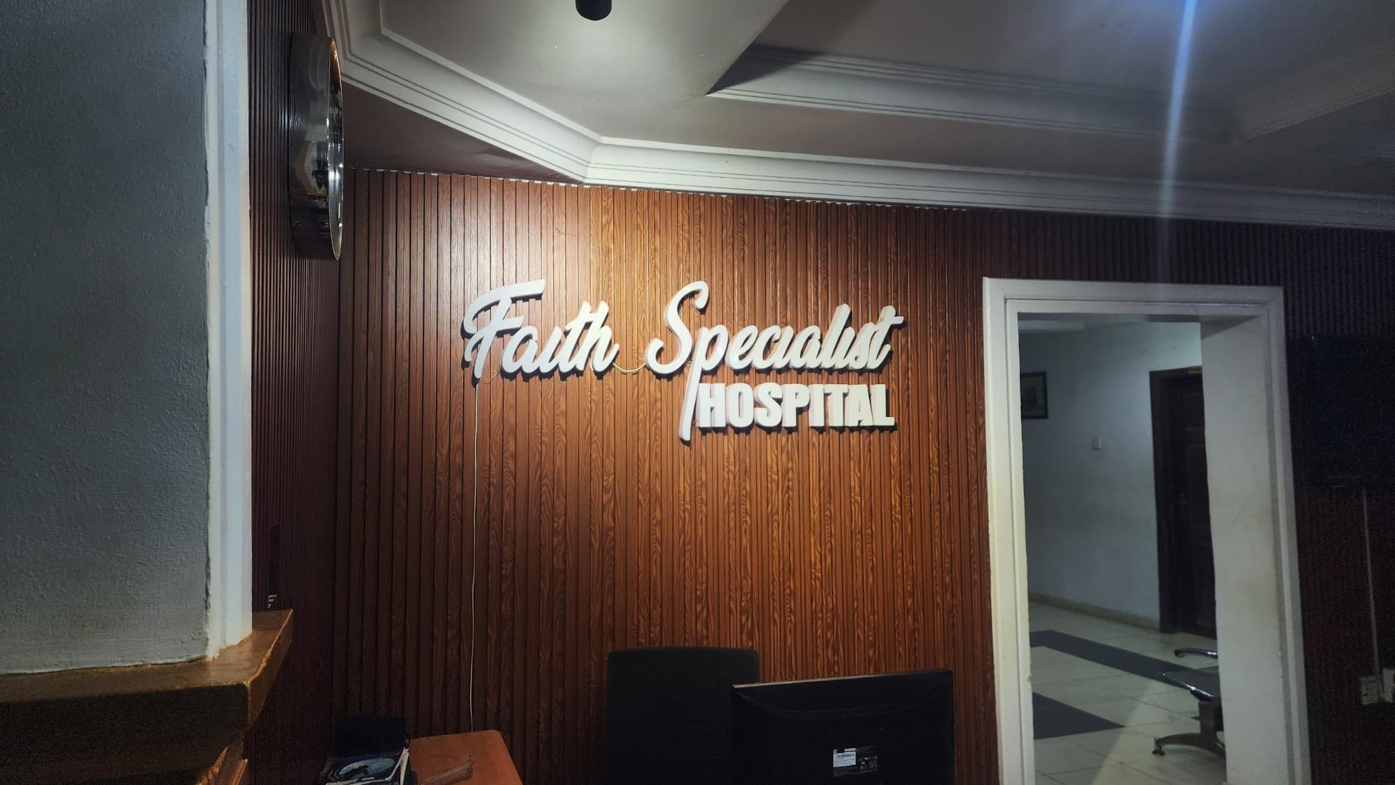 Faith Specialist Hospital reception signage